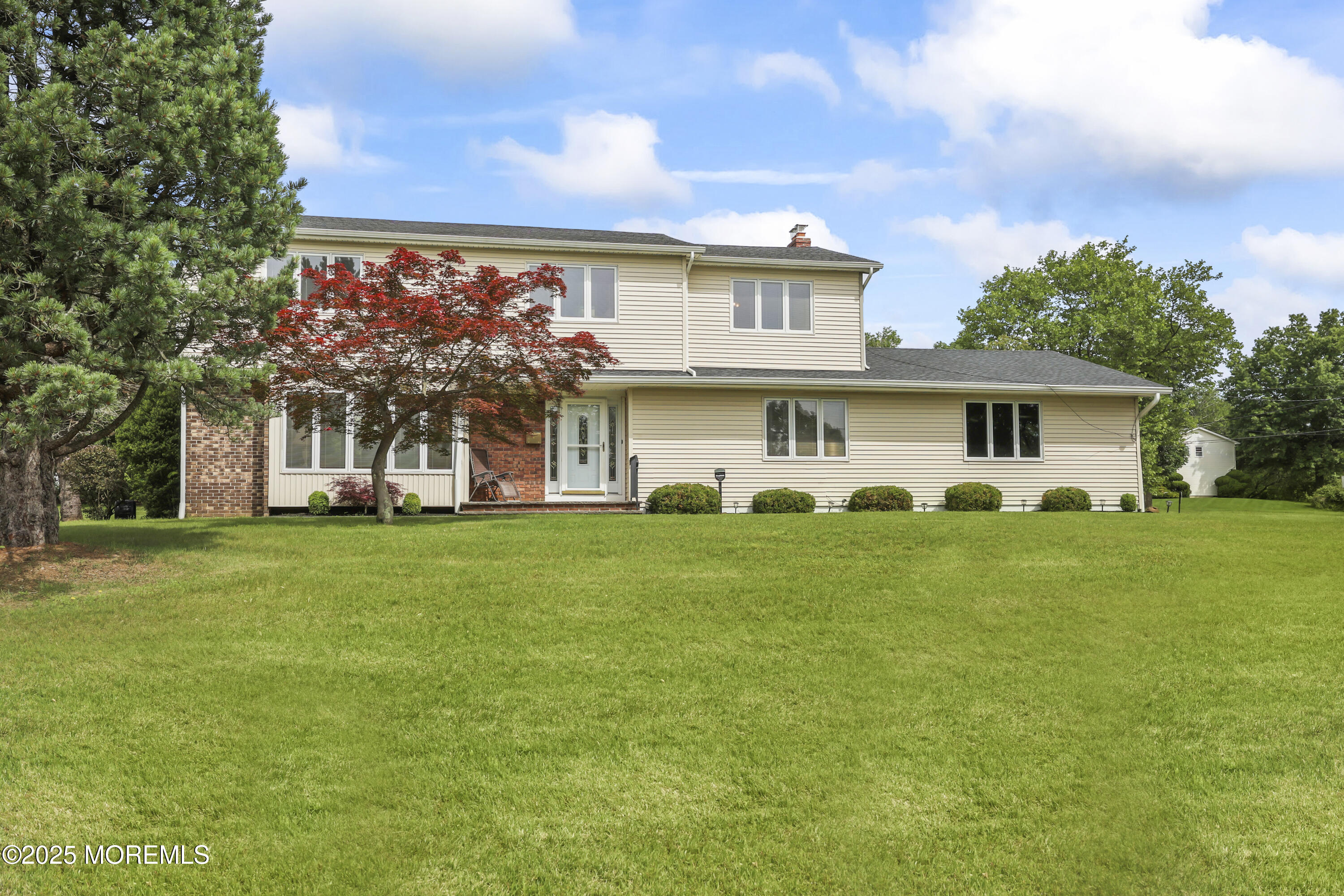 27 Sargent Road Freehold, NJ 07728 - Photo 44 of 47 a front view of a house with a garden