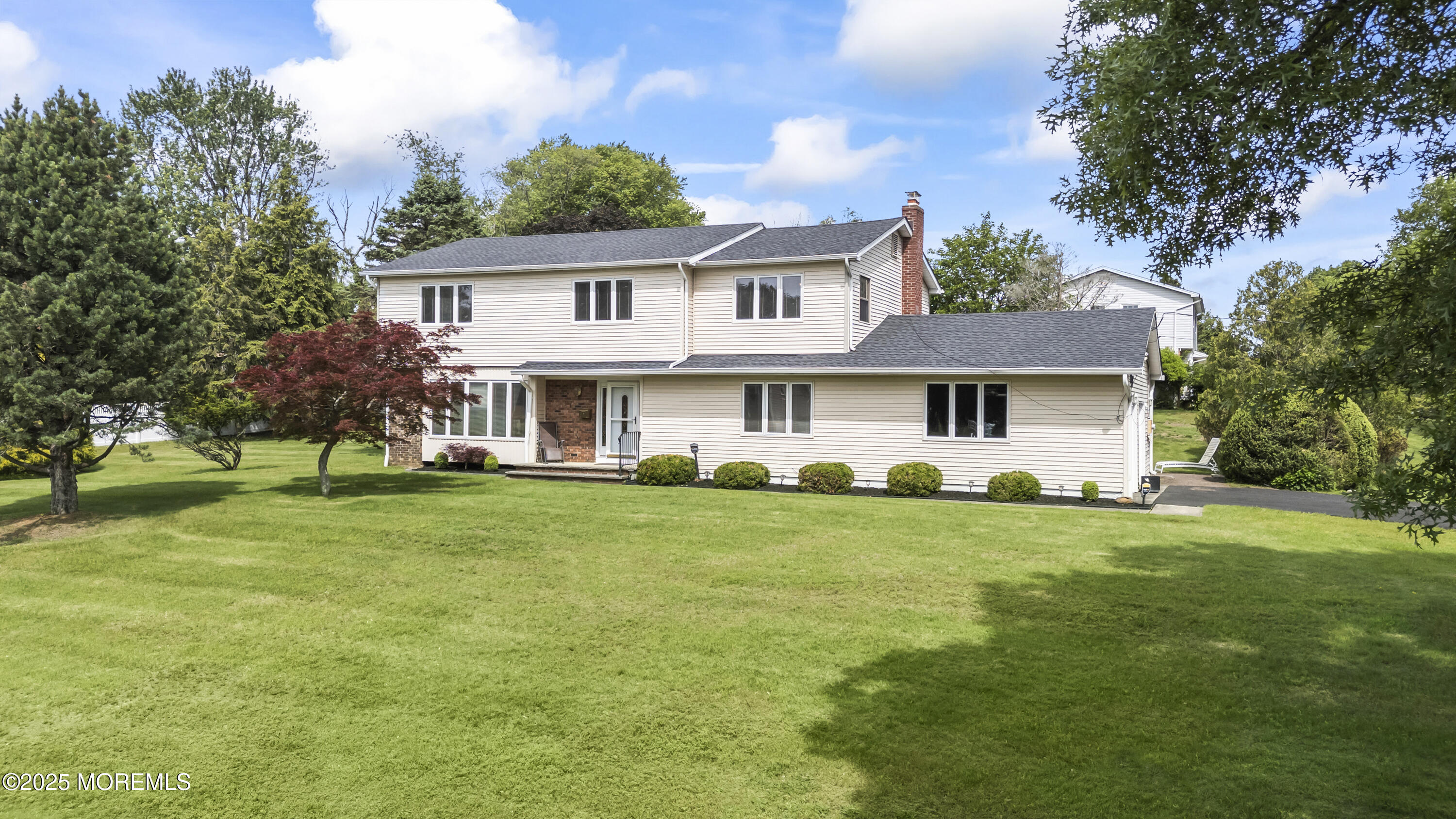 27 Sargent Road Freehold, NJ 07728 - Photo 45 of 47 a front view of a house with a garden
