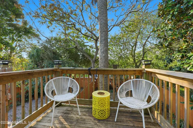 a bathroom with a sink a toilet a mirror a vanity and shower