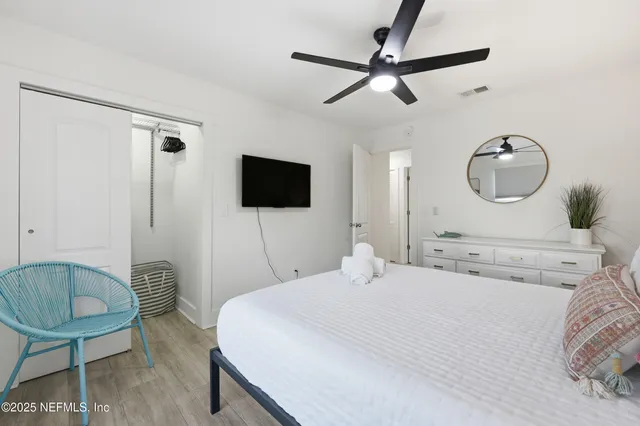 a living room with a bed and a table