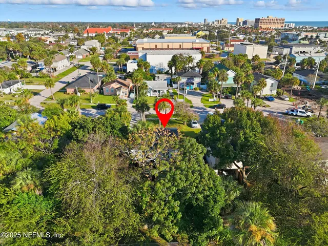 an aerial view of residential houses with outdoor space