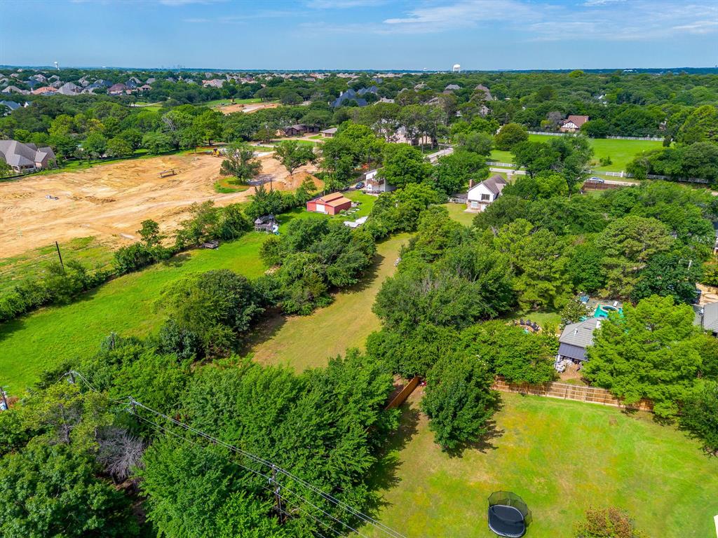 7404 John McCain Road Colleyville, TX 76034 - Photo 10 of 21 a view of a lake with a city