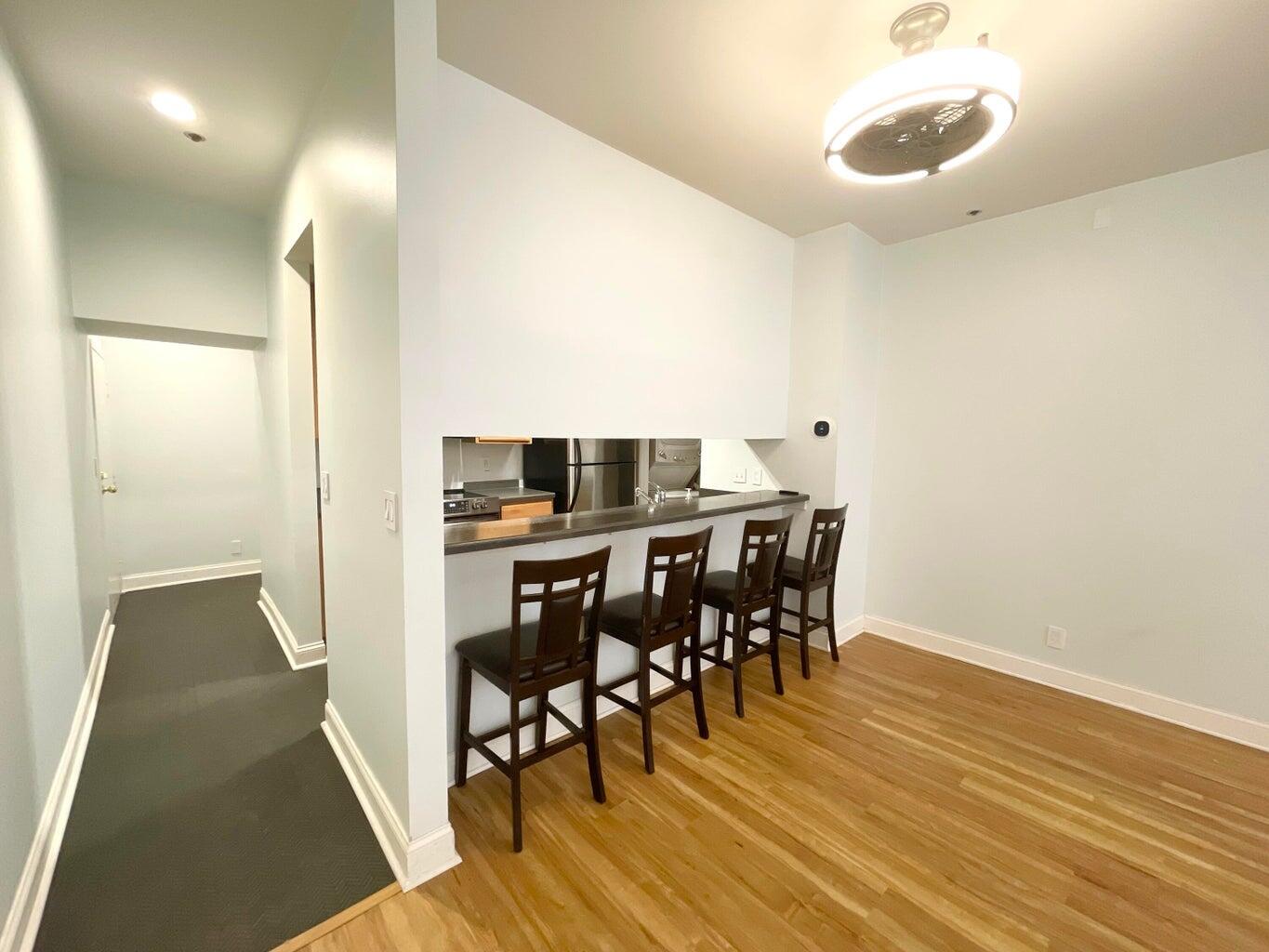 234 North Broadway, Unit 217 Milwaukee, WI 53202 - Photo 6 of 17 Entrance Hallway & Bar Seating