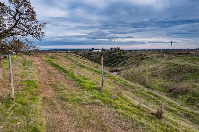 a view of a large body of water with a building in the background