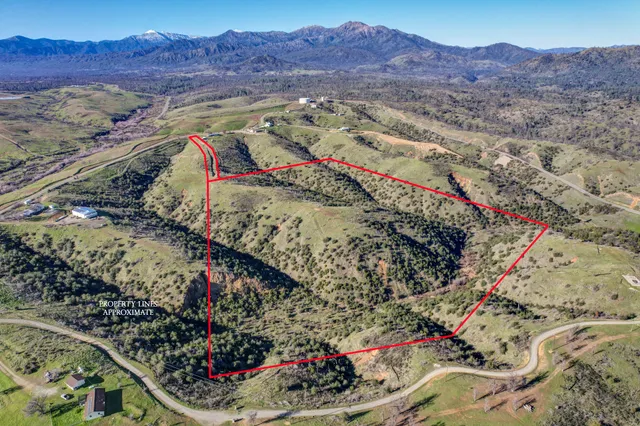 a view of mountain with sunset