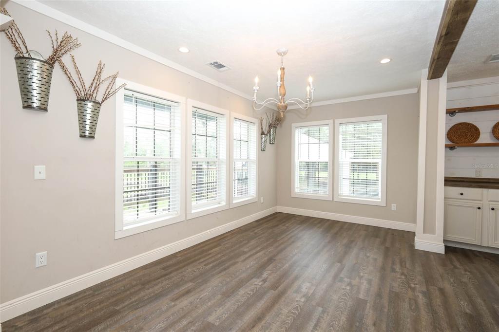 2269 Mullet Lake Park Road Geneva, FL 32732 - Photo 11 of 76 a view of an empty room with a window and wooden floor