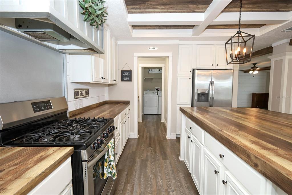 2269 Mullet Lake Park Road Geneva, FL 32732 - Photo 16 of 76 a kitchen with stainless steel appliances granite countertop a stove and a refrigerator