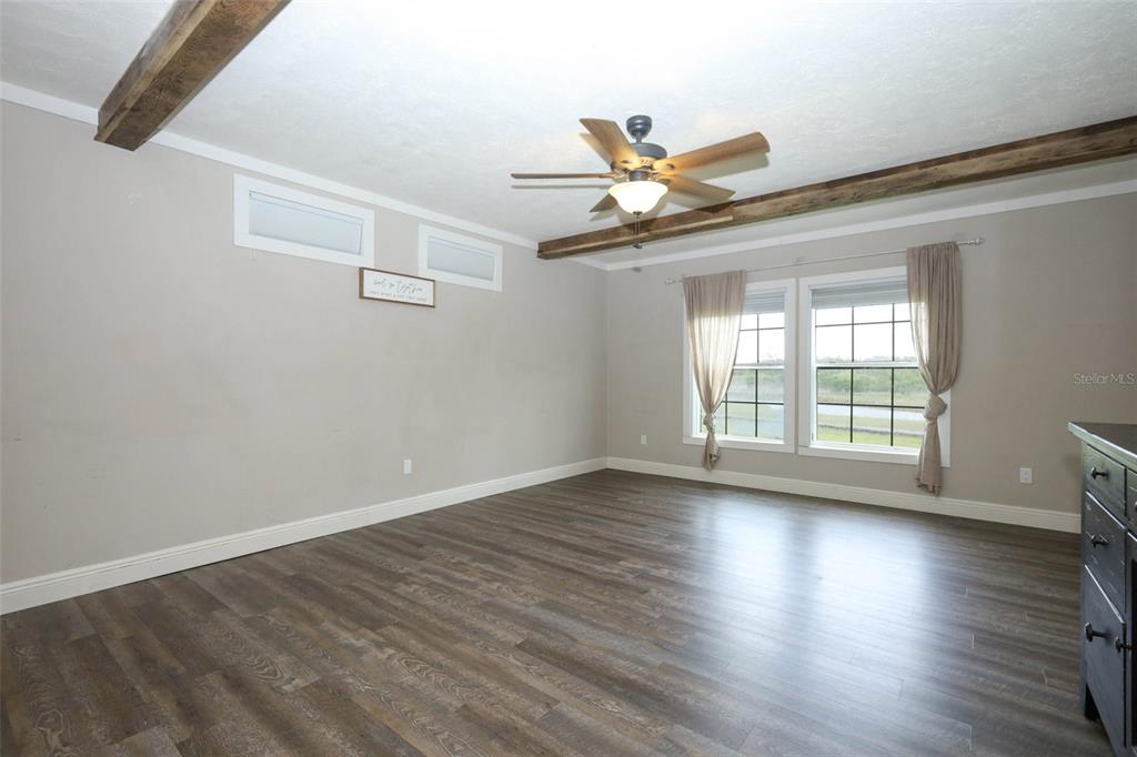 2269 Mullet Lake Park Road Geneva, FL 32732 - Photo 23 of 76 a view of an empty room with wooden floor and a window