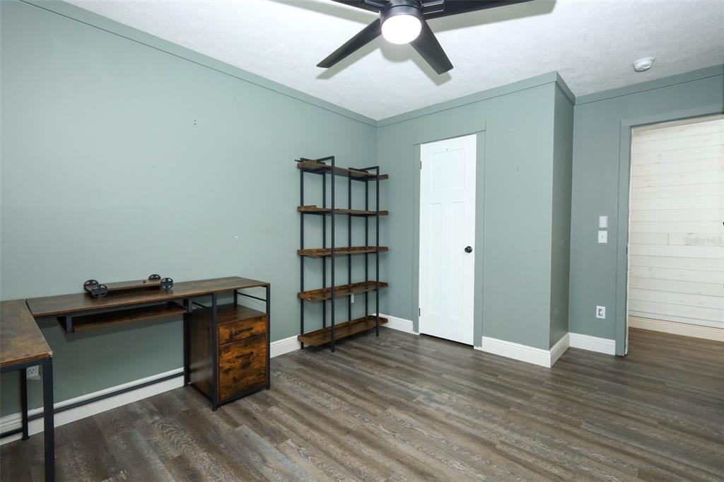 2269 Mullet Lake Park Road Geneva, FL 32732 - Photo 31 of 76 a view of a workspace with furniture and wooden floor