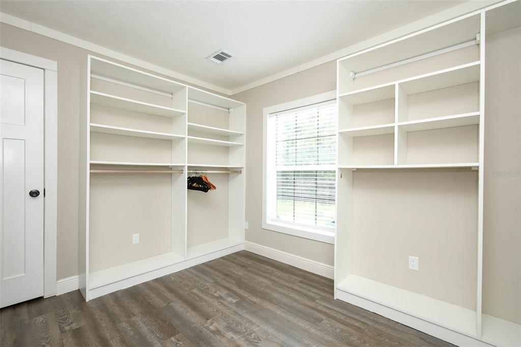 2269 Mullet Lake Park Road Geneva, FL 32732 - Photo 36 of 76 a view of an empty room with a window and wooden floor