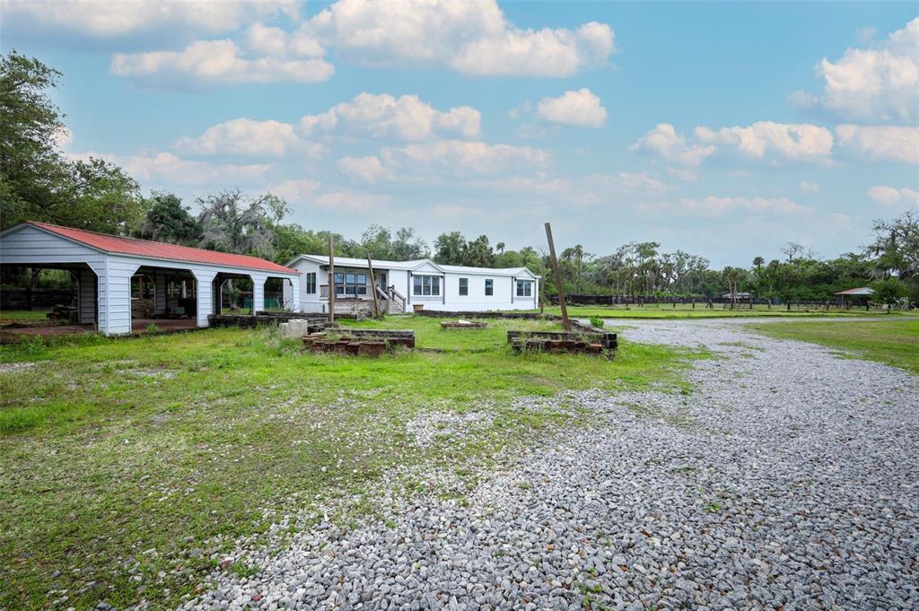 2269 Mullet Lake Park Road Geneva, FL 32732 - Photo 44 of 76 a view of a house with a yard