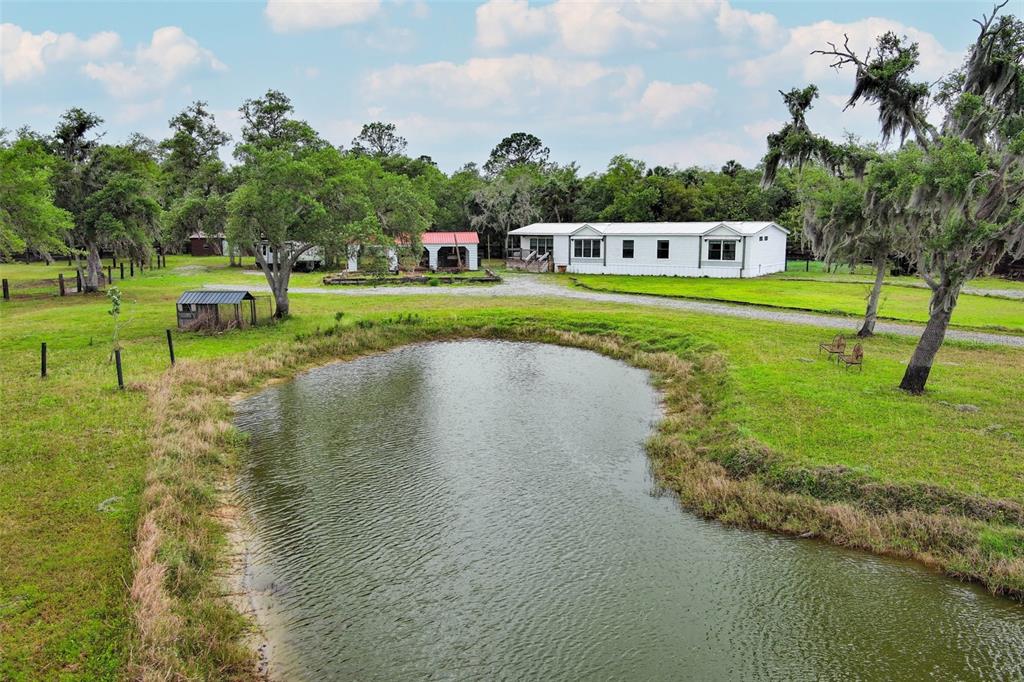 2269 Mullet Lake Park Road Geneva, FL 32732 - Photo 58 of 76 a view of a lake with a yard