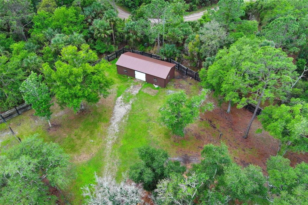 2269 Mullet Lake Park Road Geneva, FL 32732 - Photo 61 of 76 an aerial view of a house with pool yard and outdoor seating