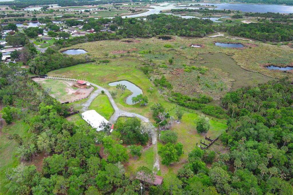 2269 Mullet Lake Park Road Geneva, FL 32732 - Photo 63 of 76 a view of a lake with a yard