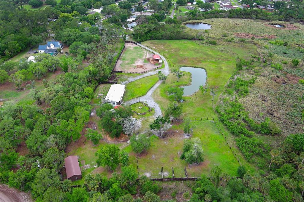2269 Mullet Lake Park Road Geneva, FL 32732 - Photo 64 of 76 an aerial view of residential houses with outdoor space and trees
