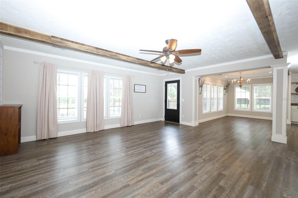 2269 Mullet Lake Park Road Geneva, FL 32732 - Photo 8 of 76 a view of an empty room with wooden floor and a window