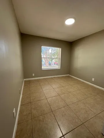 a view of an empty room and window