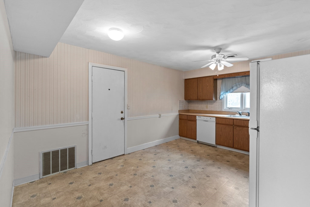 70 North Court Street, Unit F Fall River, MA 02720 - Photo 5 of 20 a kitchen with a refrigerator and a sink
