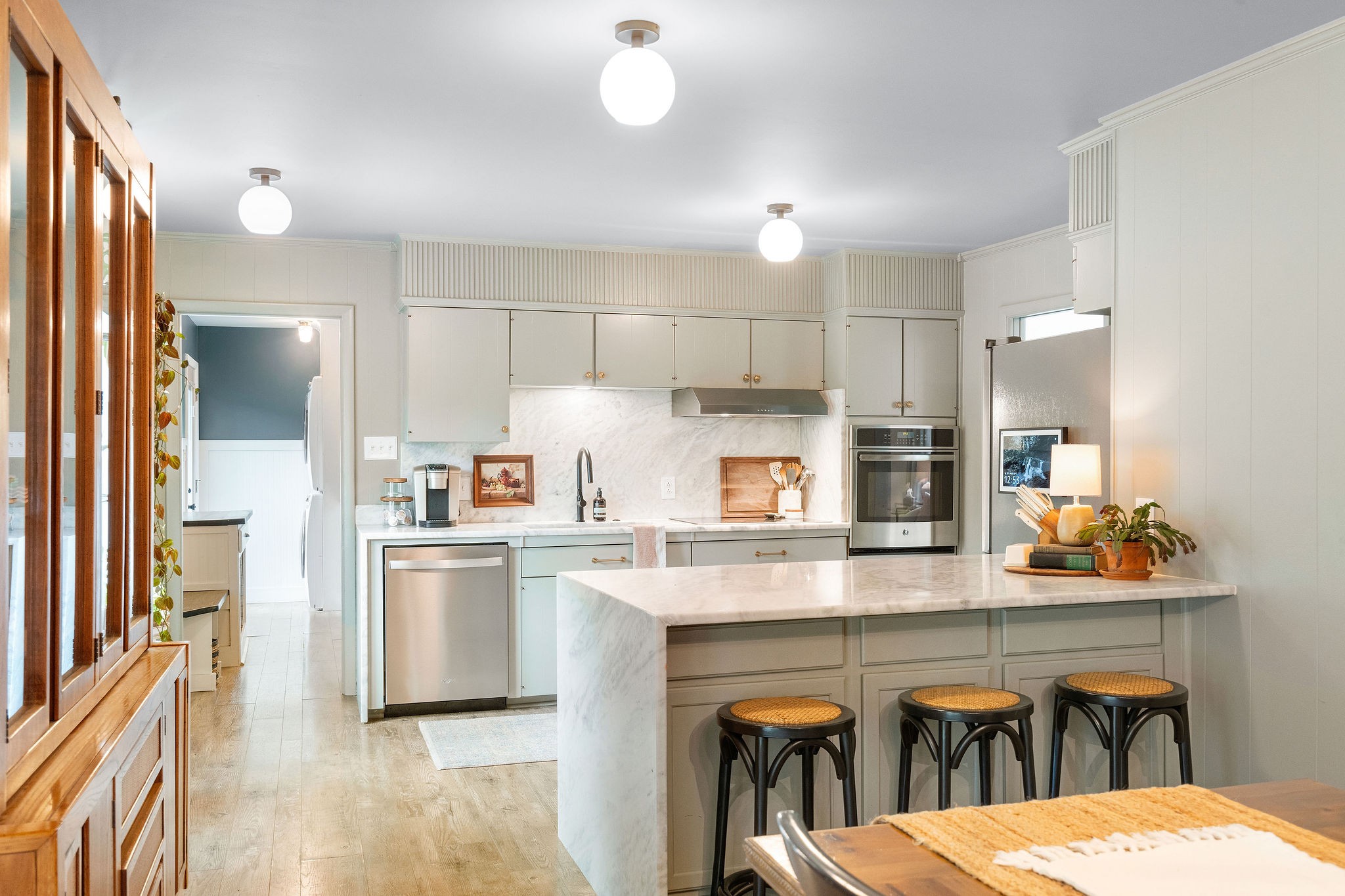 2337 Les Robinson Road Columbia, TN 38401 - Photo 13 of 42 a kitchen with stainless steel appliances kitchen island a table chairs refrigerator and sink