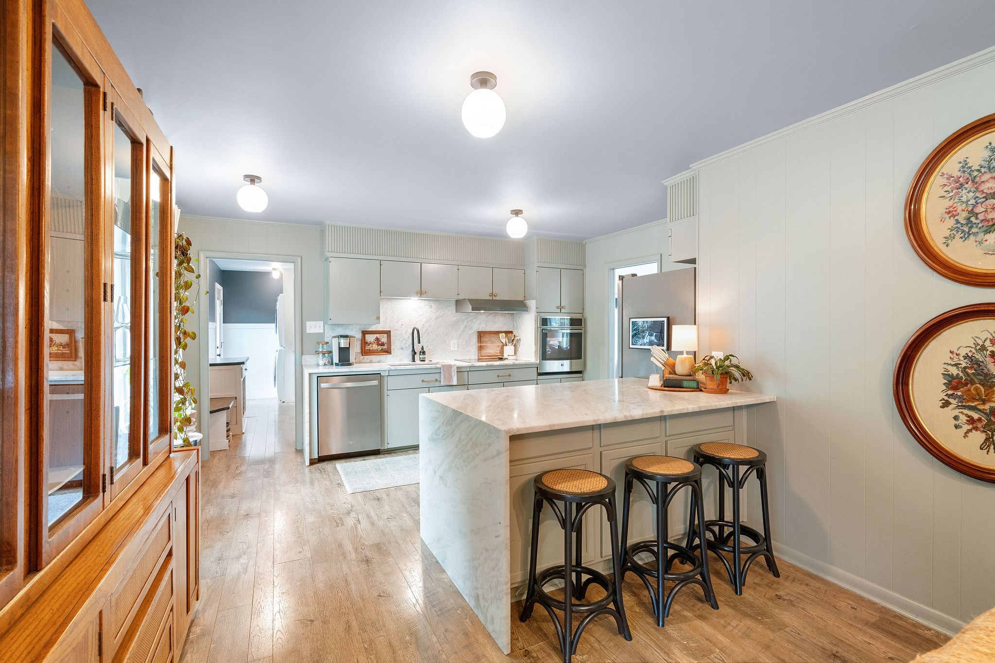 2337 Les Robinson Road Columbia, TN 38401 - Photo 14 of 42 a kitchen with a table chairs refrigerator and cabinets