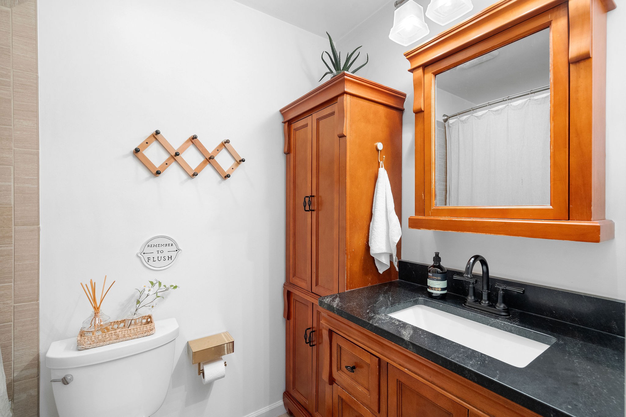 2337 Les Robinson Road Columbia, TN 38401 - Photo 25 of 42 a bathroom with a granite countertop sink and a mirror