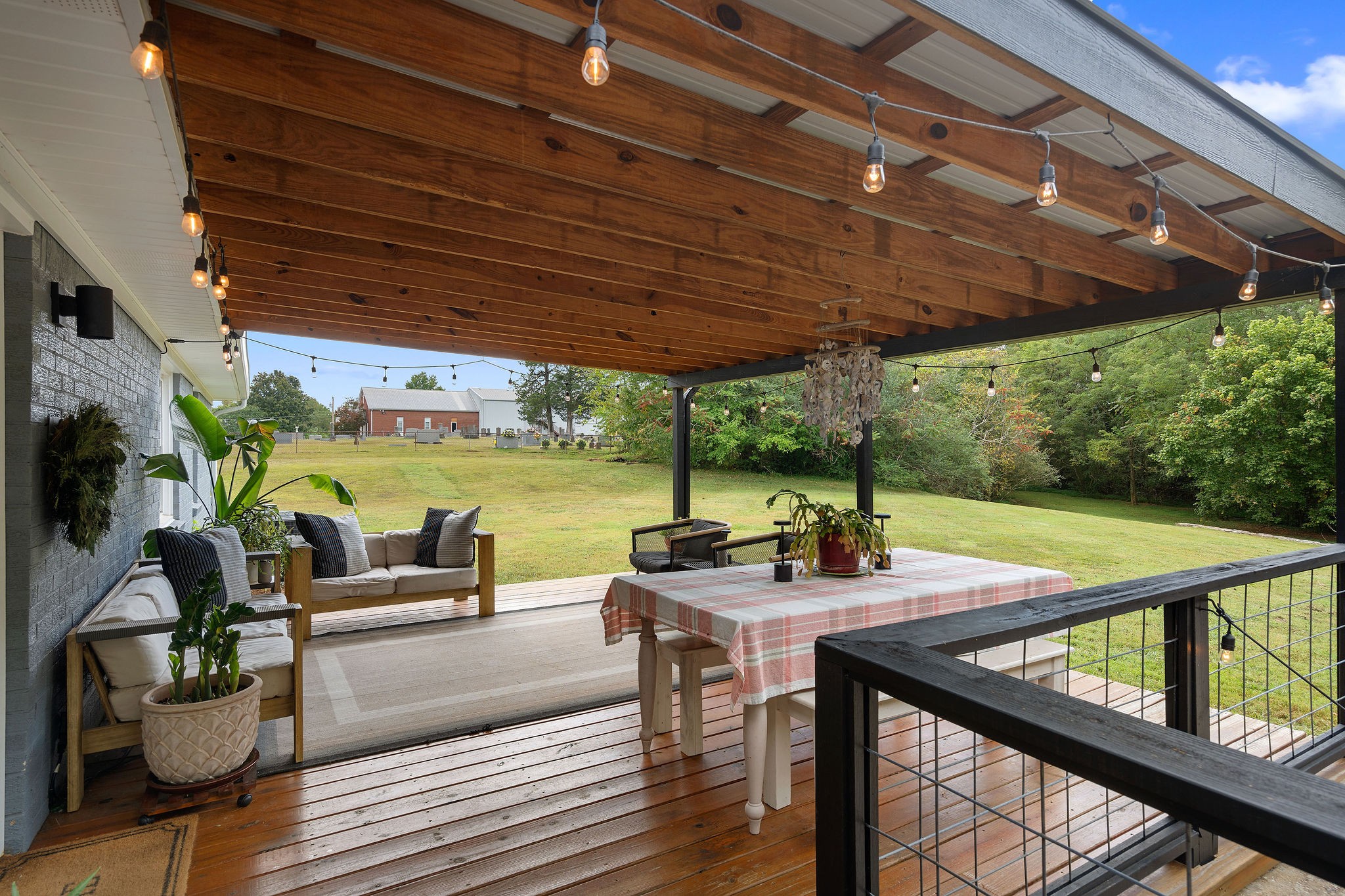 2337 Les Robinson Road Columbia, TN 38401 - Photo 33 of 42 a view of a patio with a table chairs and a patio