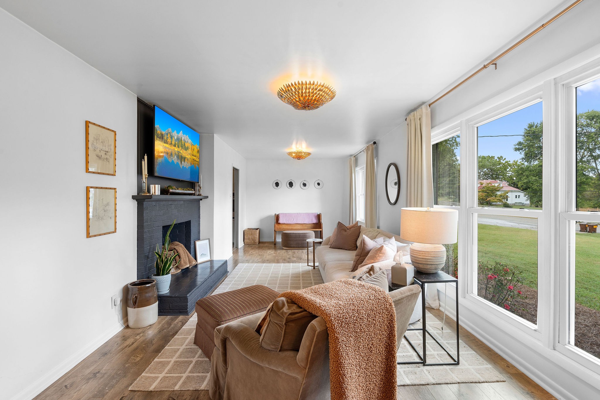 2337 Les Robinson Road Columbia, TN 38401 - Photo 7 of 42 a living room with furniture a fireplace and a floor to ceiling window