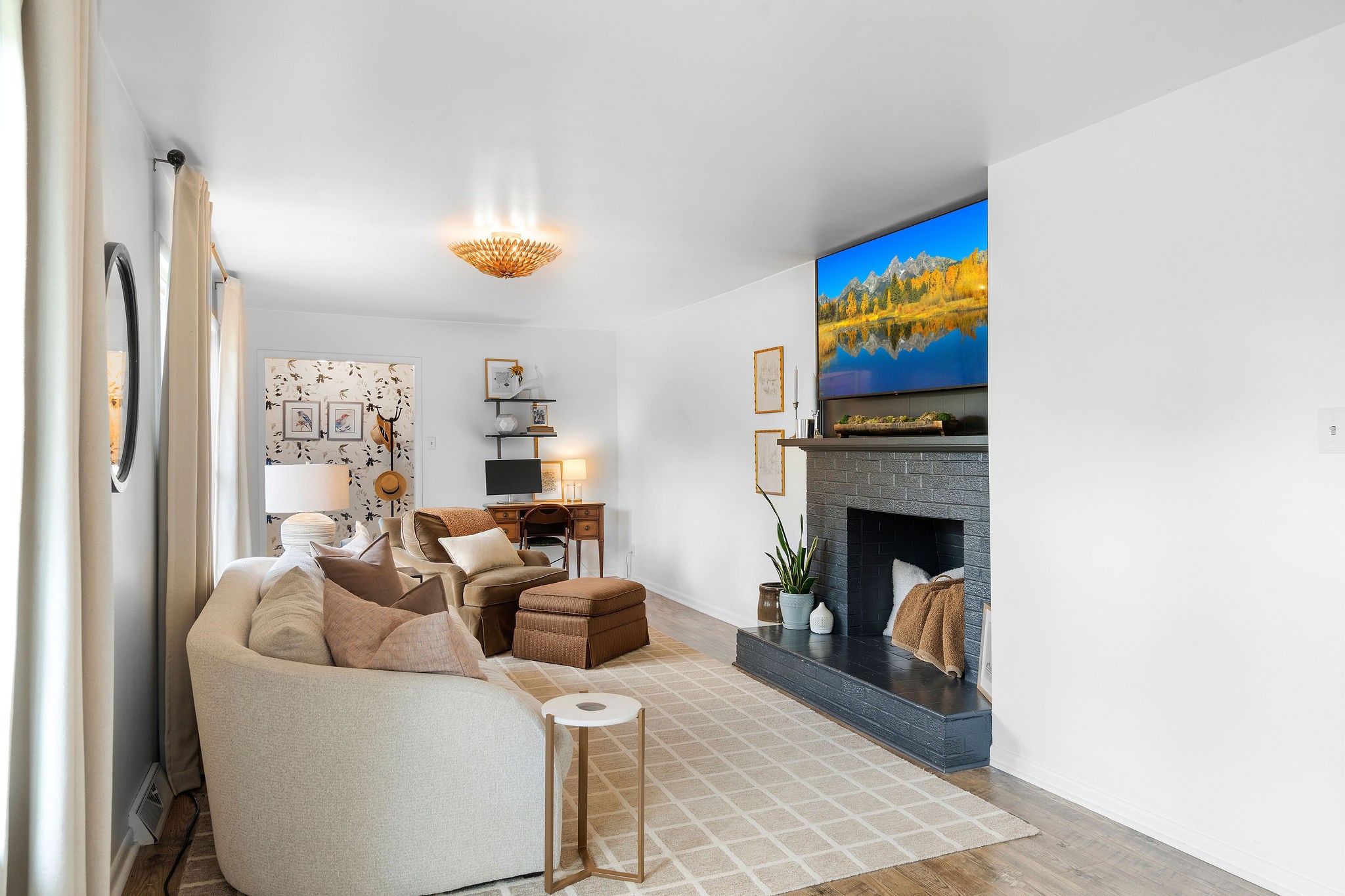 2337 Les Robinson Road Columbia, TN 38401 - Photo 9 of 42 a living room with furniture a fireplace and a flat screen tv