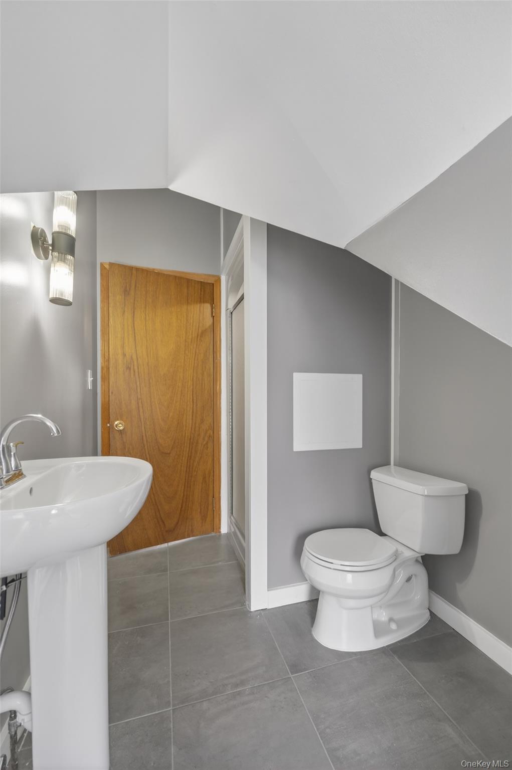 408 Bull Mill Road, Unit 2 Chester, NY 10918 - Photo 17 of 29 a bathroom with a sink a toilet and mirror