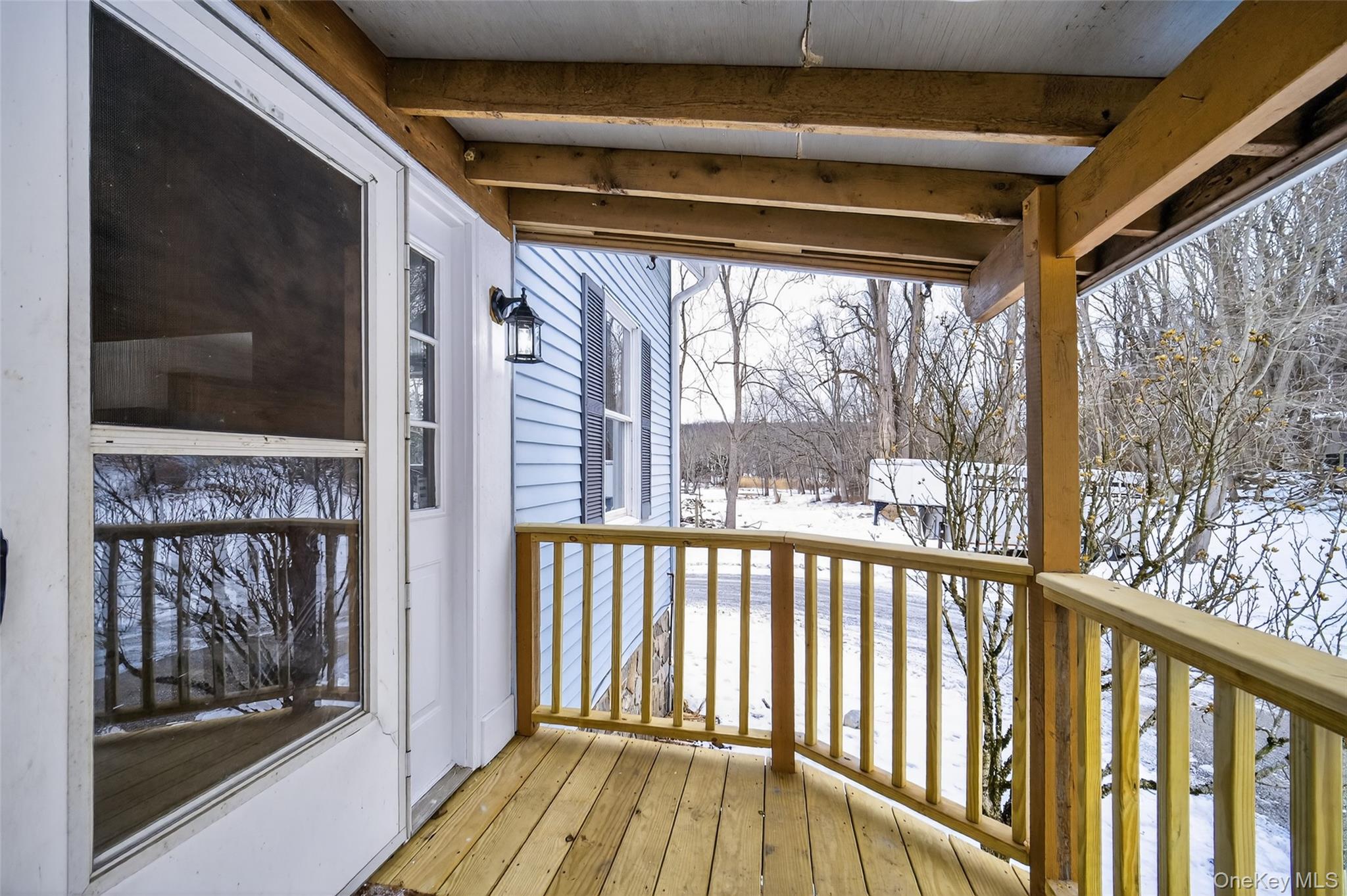 408 Bull Mill Road, Unit 2 Chester, NY 10918 - Photo 5 of 29 a view of a porch with wooden floor and furniture