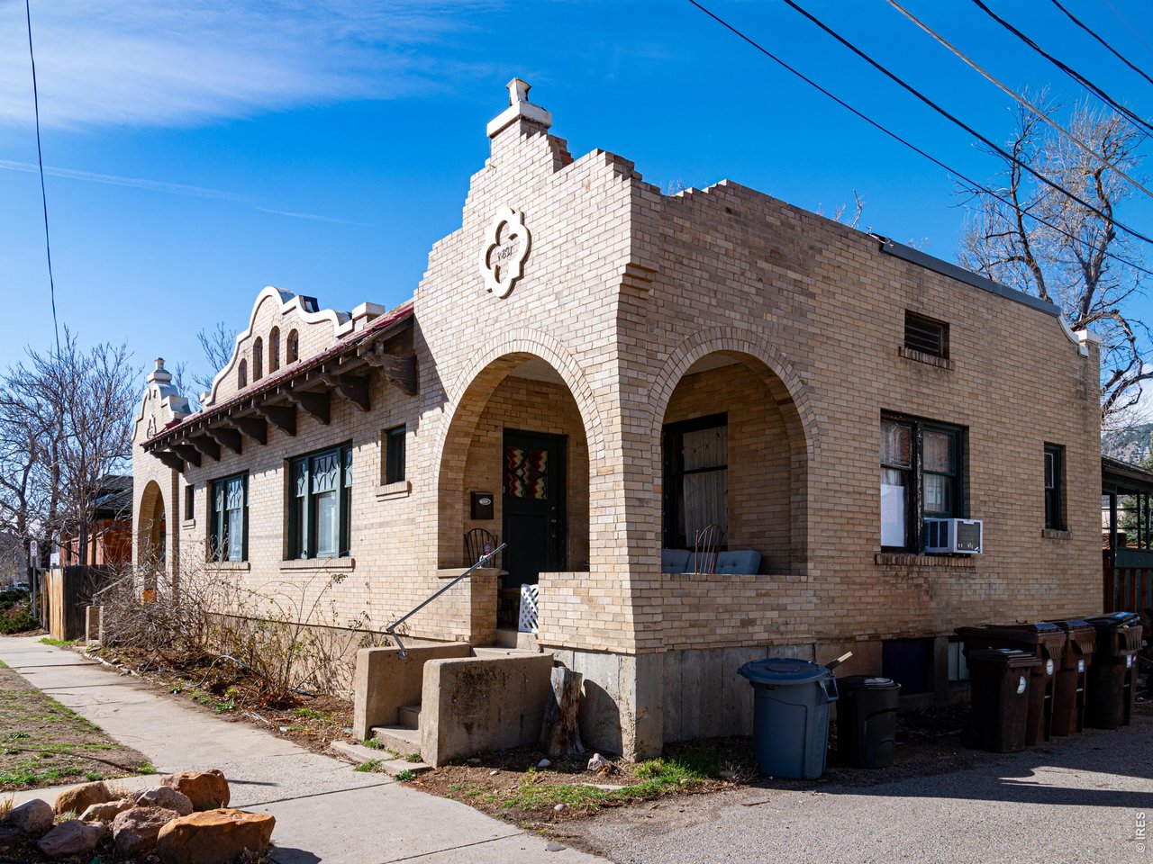 1815 17th Street Boulder, CO 80302 - Photo 2 of 8 a view of a blue house with large windows