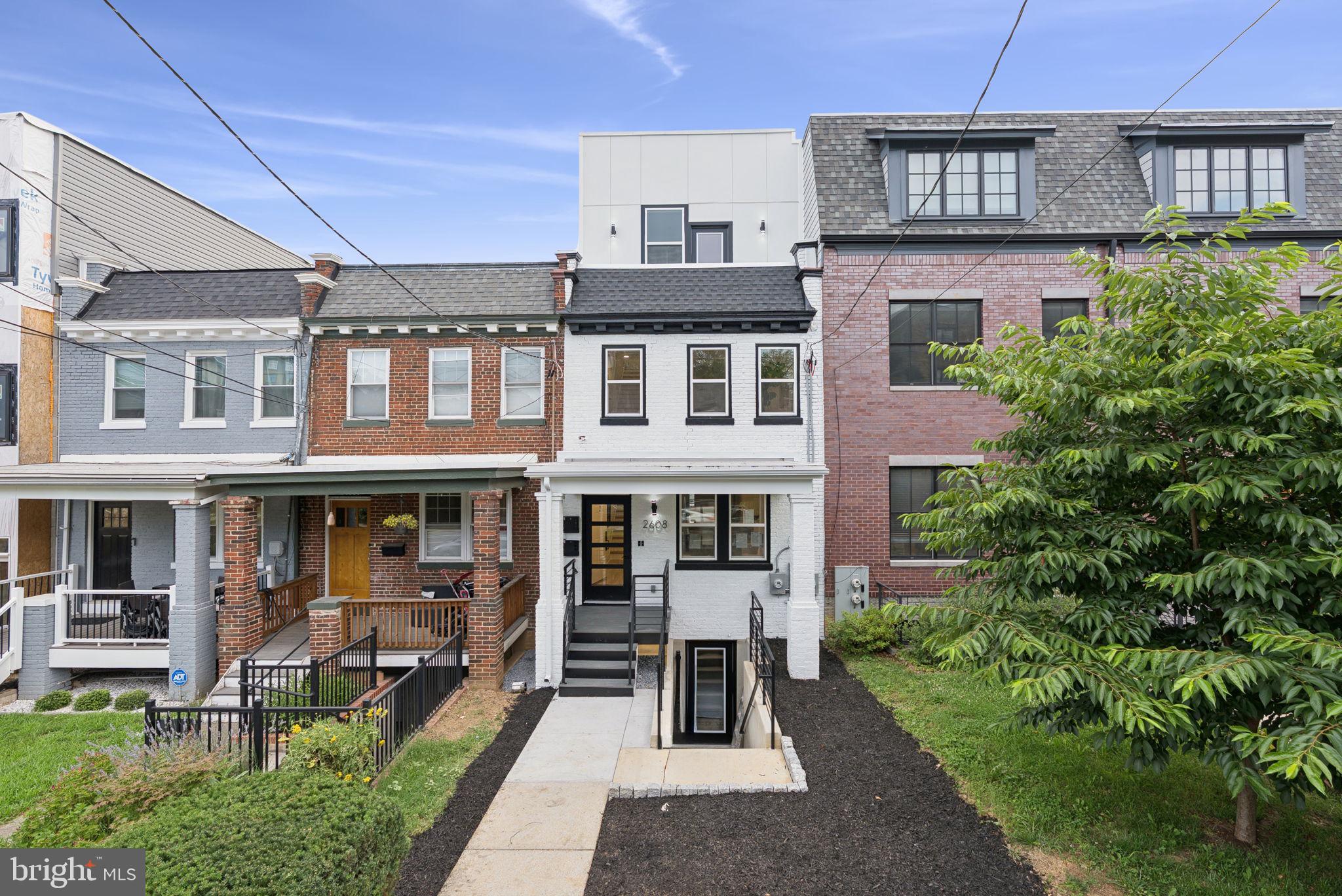 2608 4th Street Northeast, Unit 1 Washington, DC 20002 - Photo 1 of 27 a front view of a building with garden