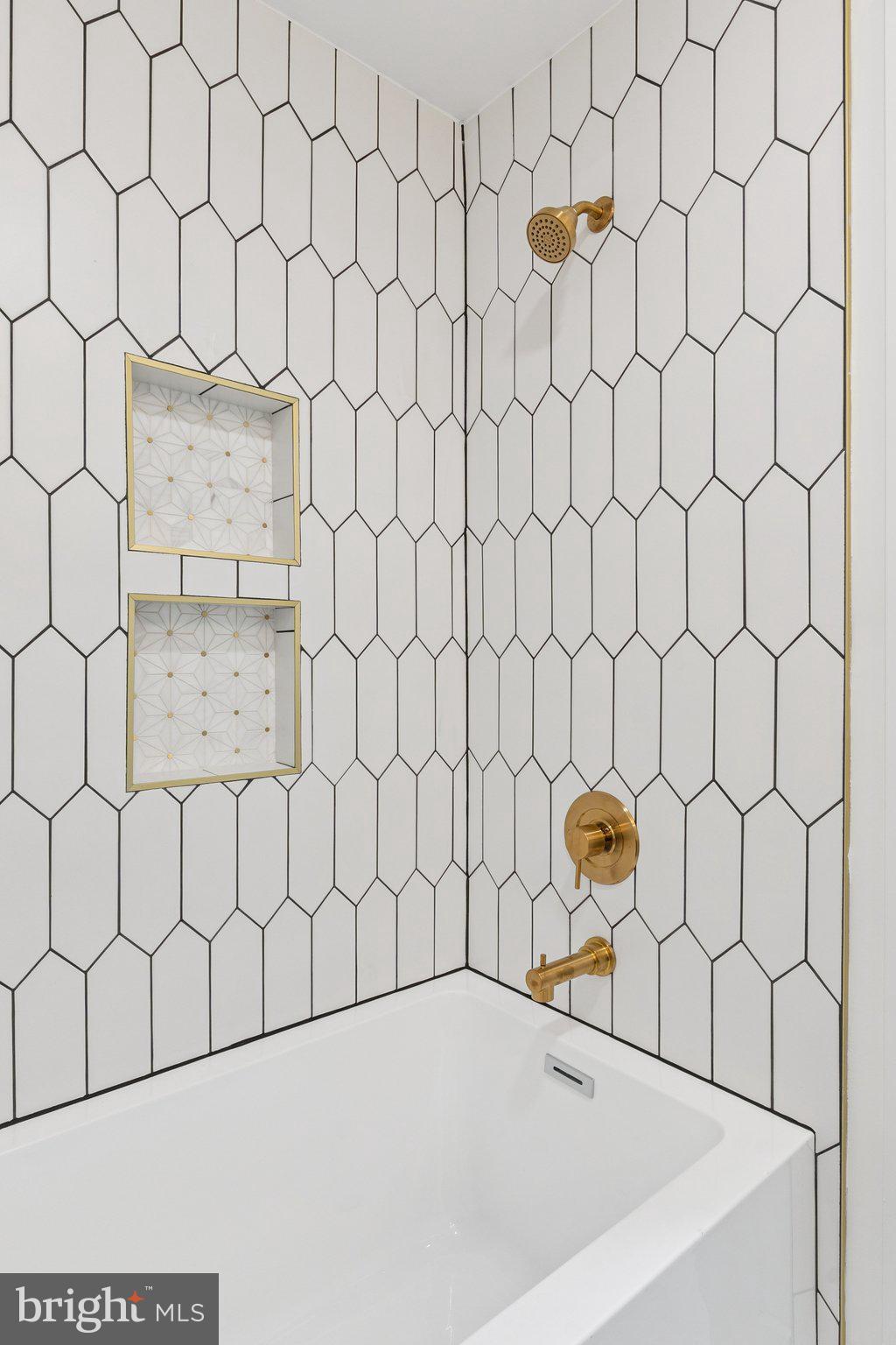 2608 4th Street Northeast, Unit 1 Washington, DC 20002 - Photo 15 of 27 a bathroom with a bathtub and a shower curtain