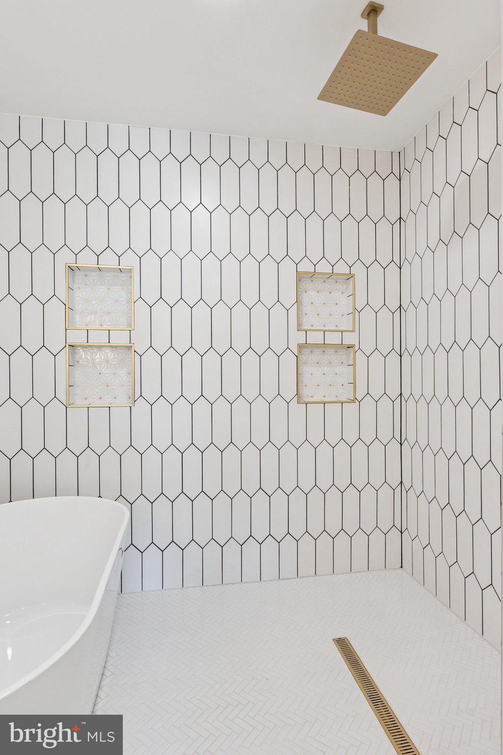 2608 4th Street Northeast, Unit 1 Washington, DC 20002 - Photo 19 of 27 a bathroom with a bathtub and shower