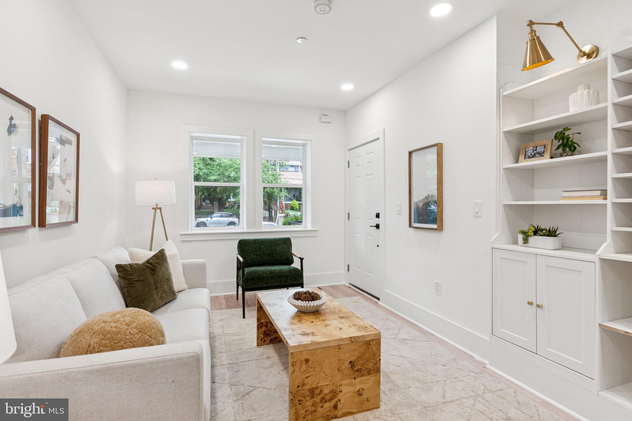 2608 4th Street Northeast, Unit 1 Washington, DC 20002 - Photo 3 of 27 a living room with furniture and a flat screen tv