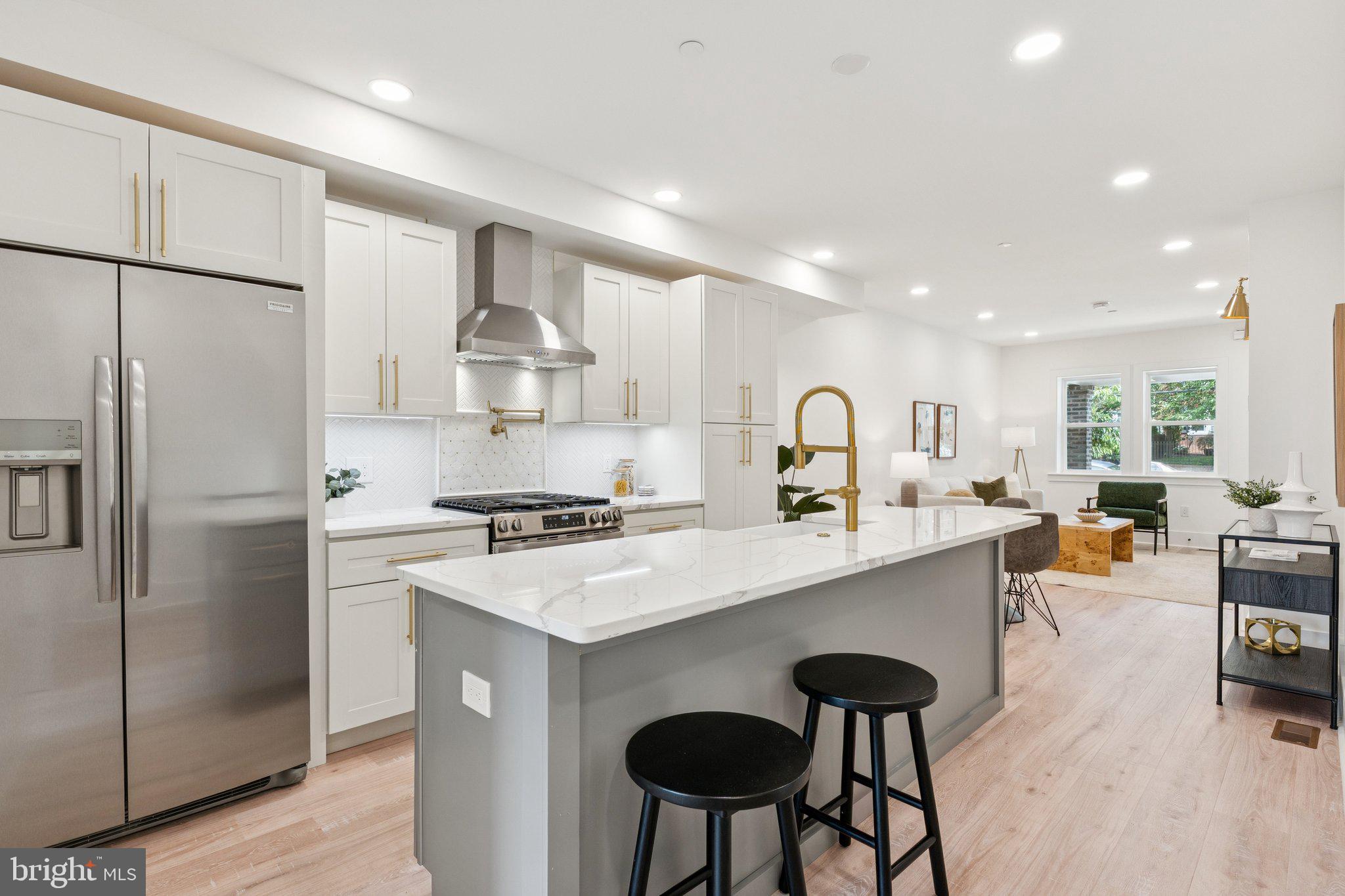2608 4th Street Northeast, Unit 1 Washington, DC 20002 - Photo 8 of 27 a kitchen with stainless steel appliances a sink stove and refrigerator