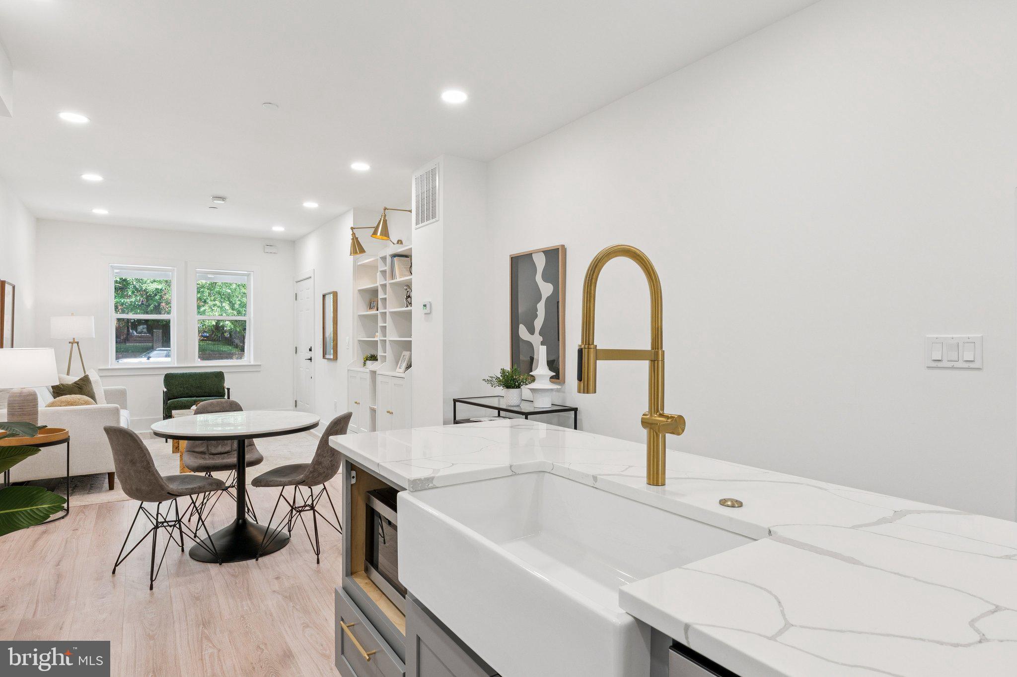 2608 4th Street Northeast, Unit 1 Washington, DC 20002 - Photo 9 of 27 a view of a kitchen with a dining table and chairs