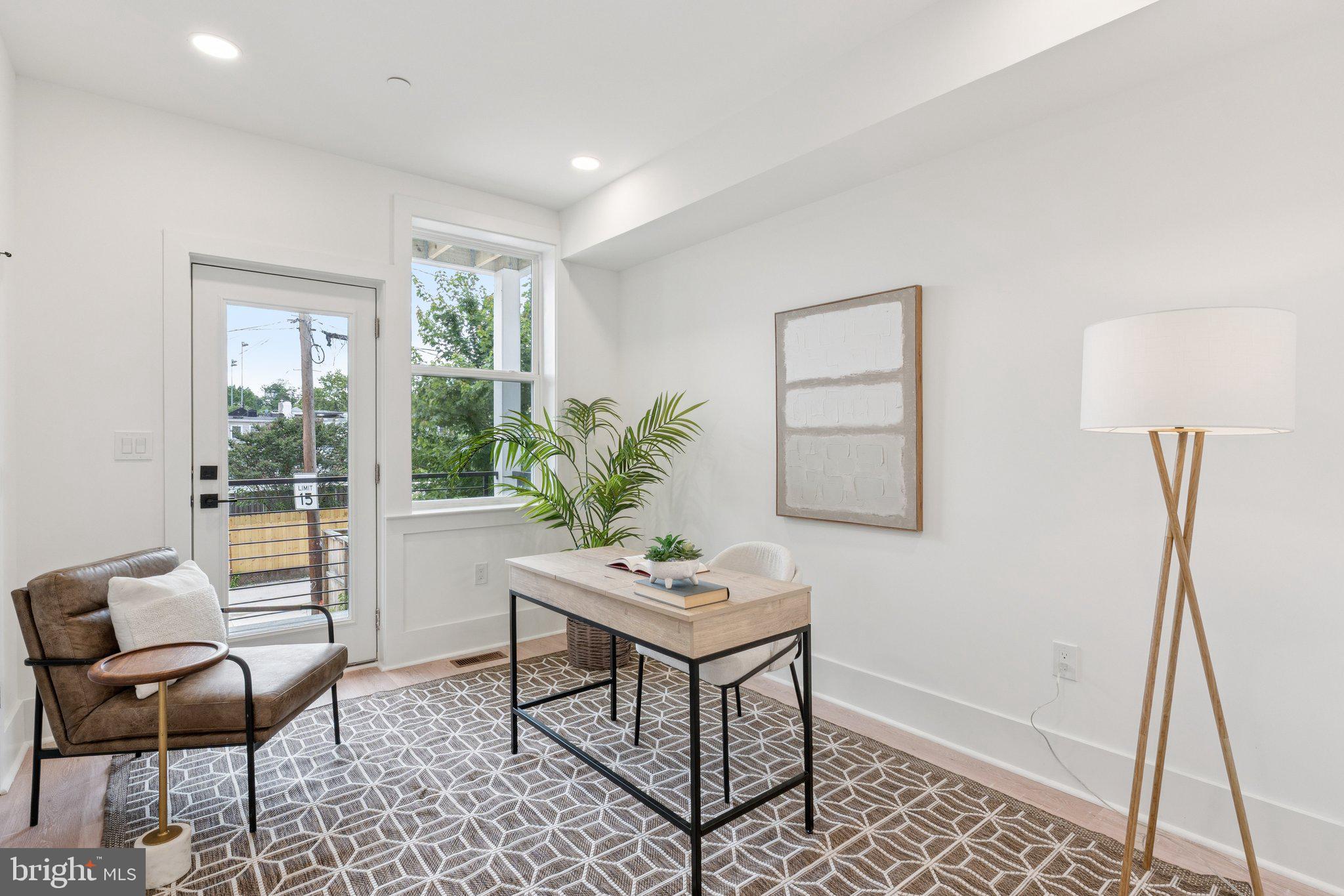 2608 4th Street Northeast, Unit 1 Washington, DC 20002 - Photo 10 of 27 a living room with furniture and a window