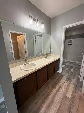 a bathroom with a sink and a mirror