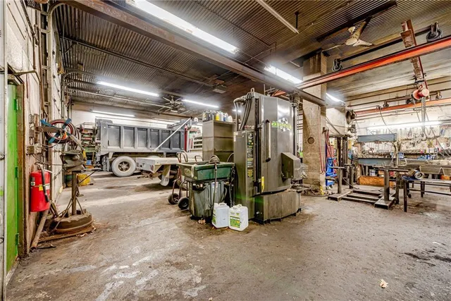 a view of a hallway with furniture and entryway