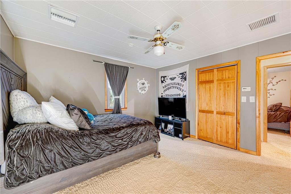 175 Mt Joy Road Mount Pleasant, PA 15666 - Photo 21 of 38 a bedroom with a bed and wooden floor