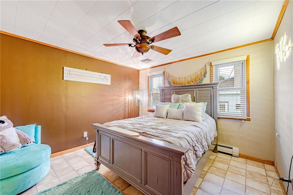 175 Mt Joy Road Mount Pleasant, PA 15666 - Photo 24 of 38 a bedroom with a bed and a chandelier