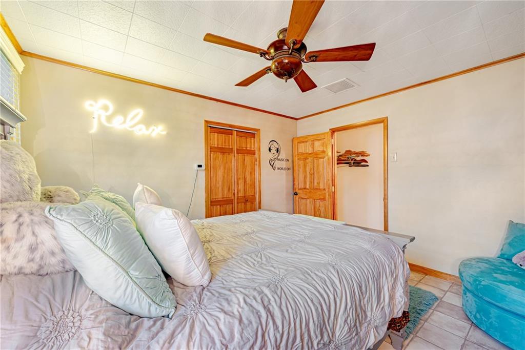 175 Mt Joy Road Mount Pleasant, PA 15666 - Photo 25 of 38 a bedroom with a bed and a chandelier