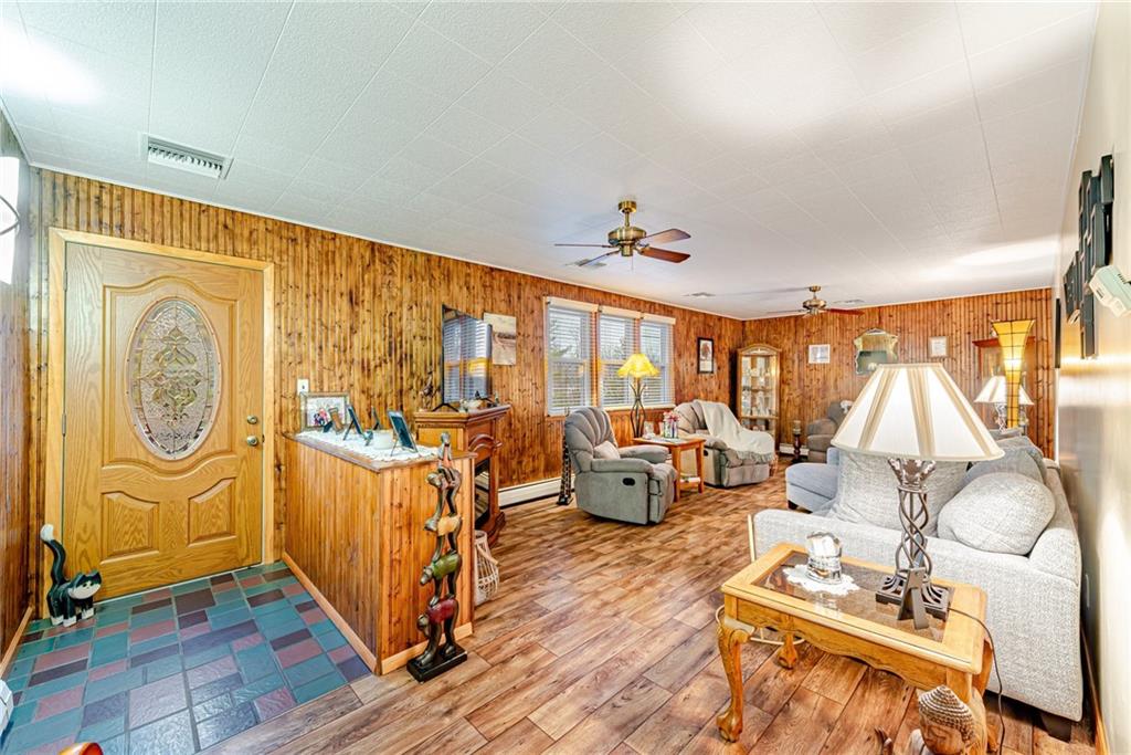 175 Mt Joy Road Mount Pleasant, PA 15666 - Photo 28 of 38 a living room with furniture and a floor to ceiling window