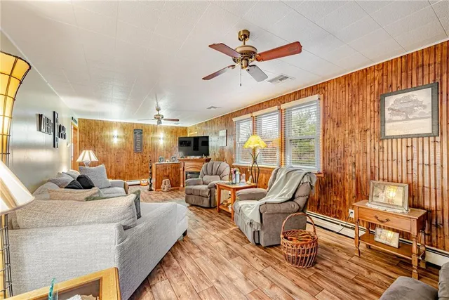 a living room with furniture and a lamp