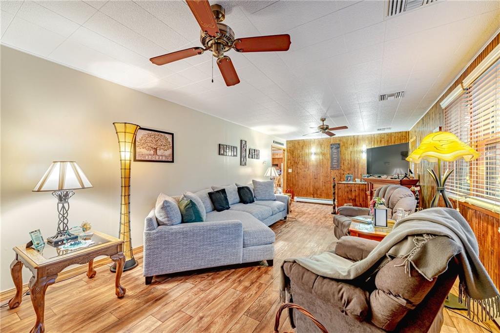 175 Mt Joy Road Mount Pleasant, PA 15666 - Photo 30 of 38 a living room with furniture and a lamp