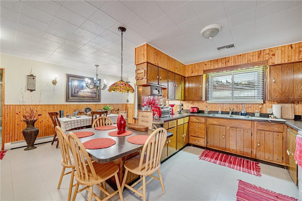175 Mt Joy Road Mount Pleasant, PA 15666 - Photo 34 of 38 a kitchen with a sink and chairs