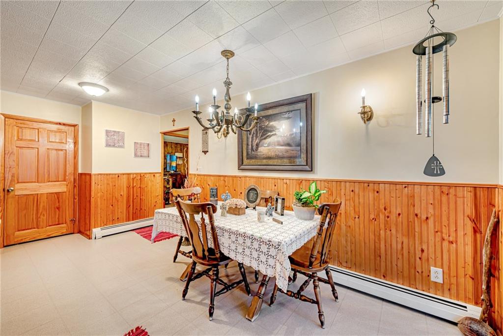 175 Mt Joy Road Mount Pleasant, PA 15666 - Photo 37 of 38 a view of a dining room with furniture and chandelier
