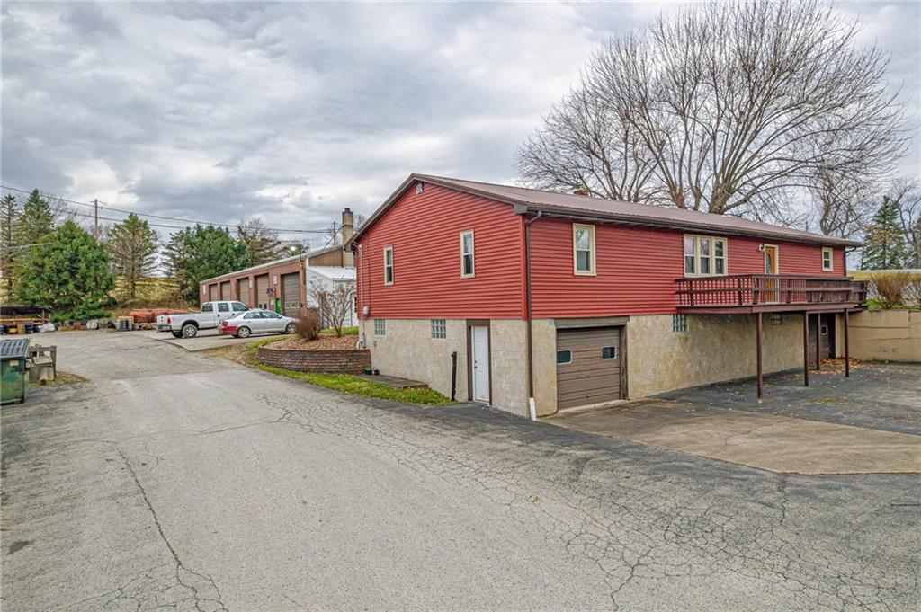 175 Mt Joy Road Mount Pleasant, PA 15666 - Photo 4 of 38 a front view of a house with a yard and garage
