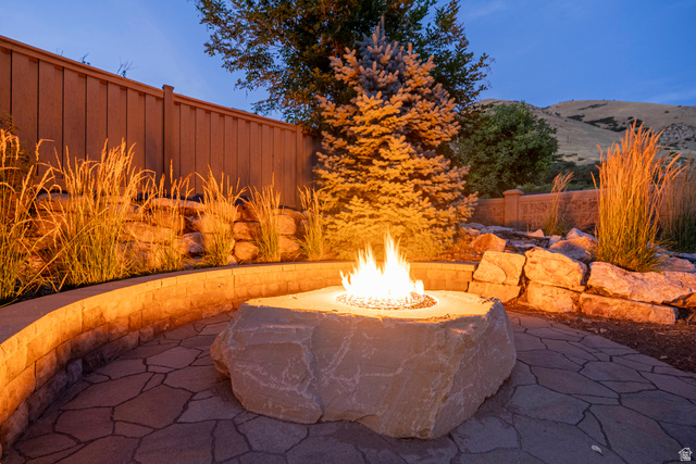 687 South 2080th Street East Springville, UT 84663 - Photo 144 of 149 Outdoor flagstone patio featuring a built-in stone fire pit